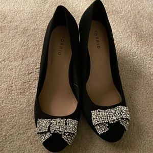 Never worn black torrid heels (about 2.5 inches) with diamond bow. Never worn.